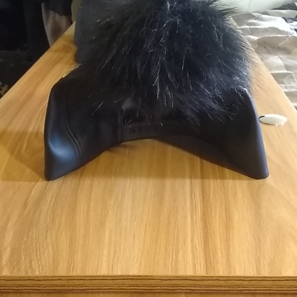Baseball cap with fur ball